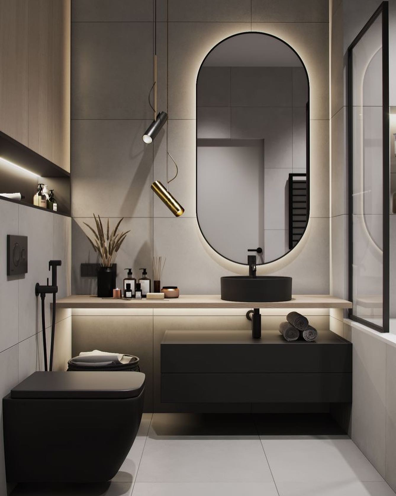 دکوراسیون روشویی لوکس با آینه بیضی بک‌لایت، کاسه روشویی روکار مشکی و نورپردازی تاکیدی زیر کابینت.